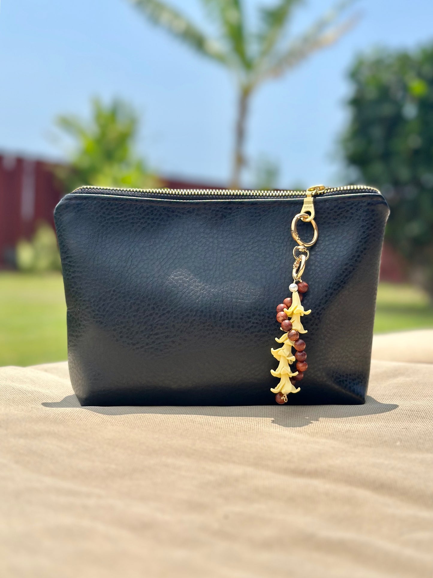 Hawaiian Lei Bag Chain – Sandalwood Beads with Island Flower Charm